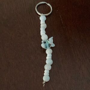 A white fish beaded keychain